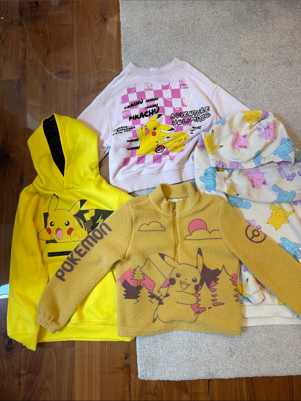 Lot of Four Pokémon and Pikachu Kids Hoodies and Sweaters.